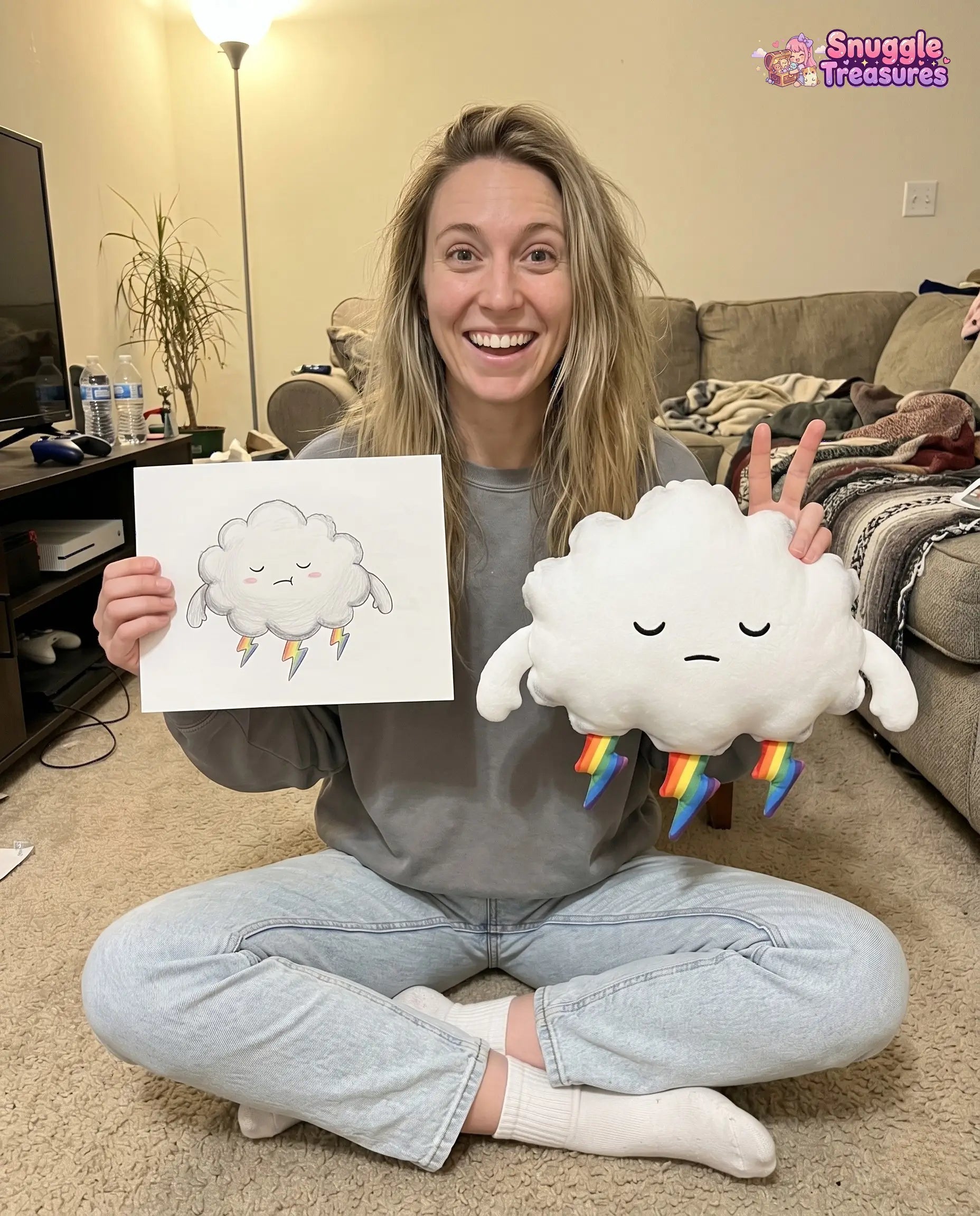 custom stuffed animal from drawing handmade plush — person holding a drawing of a cloud and a plush cloud toy with rainbow socks in a living room.